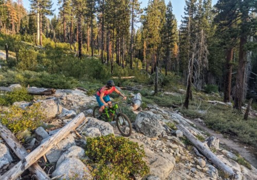 Woman mountain biking rocky trail in El Dorado County