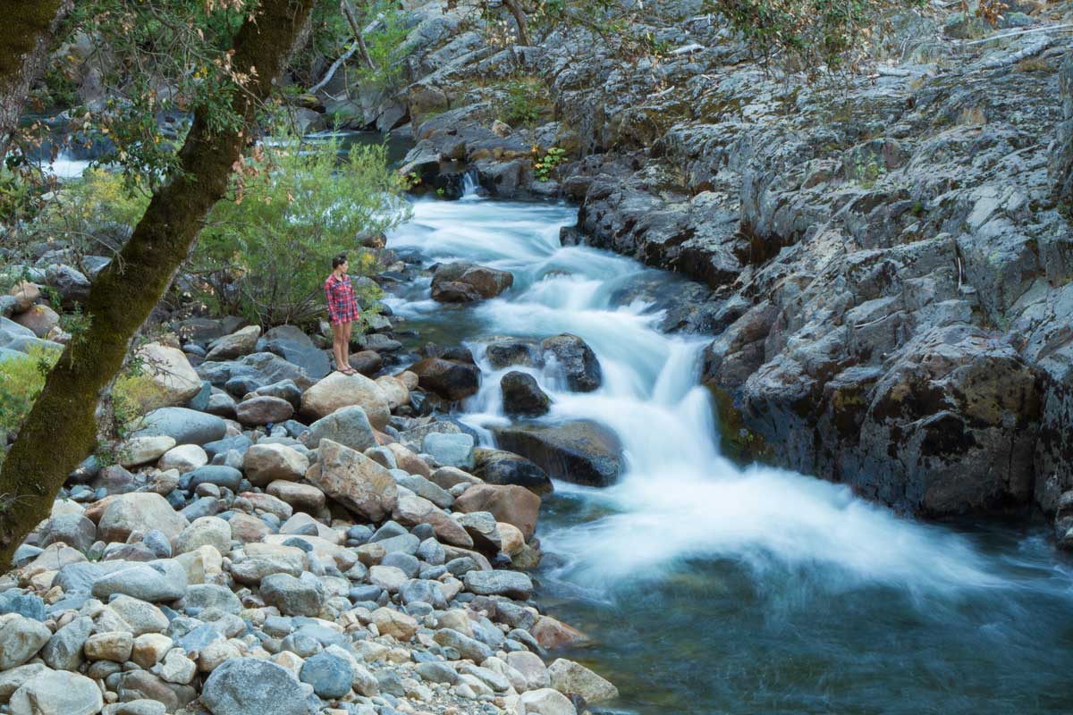 woman-standing-next-to-the-American-River